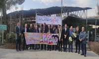 بسیجیان سازمان اموال تملیکی مزار شهدا را گلباران کردند